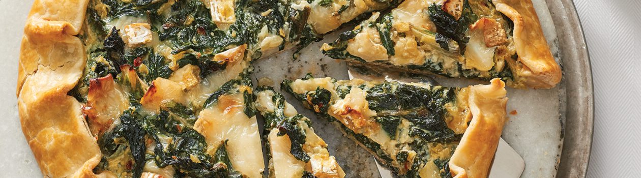 Swiss chard galette pie on a white plate.