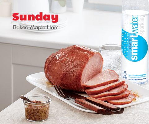 meal-8 Sunday. Baked Maple Ham plate shown with container of mustard, as well as a glass and bottle of sparkling smartwater