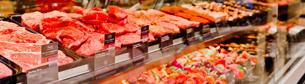 Fully stocked Sobeys meat case featuring various cuts and protein types.