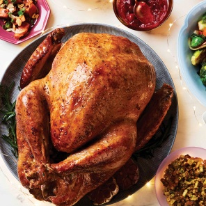  Roasted turkey on a white platter.