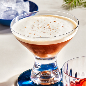 Café alexander in a small martini glass on a blue plate