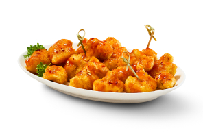 Hot Honey Cauliflower Bites in bowl with white background.