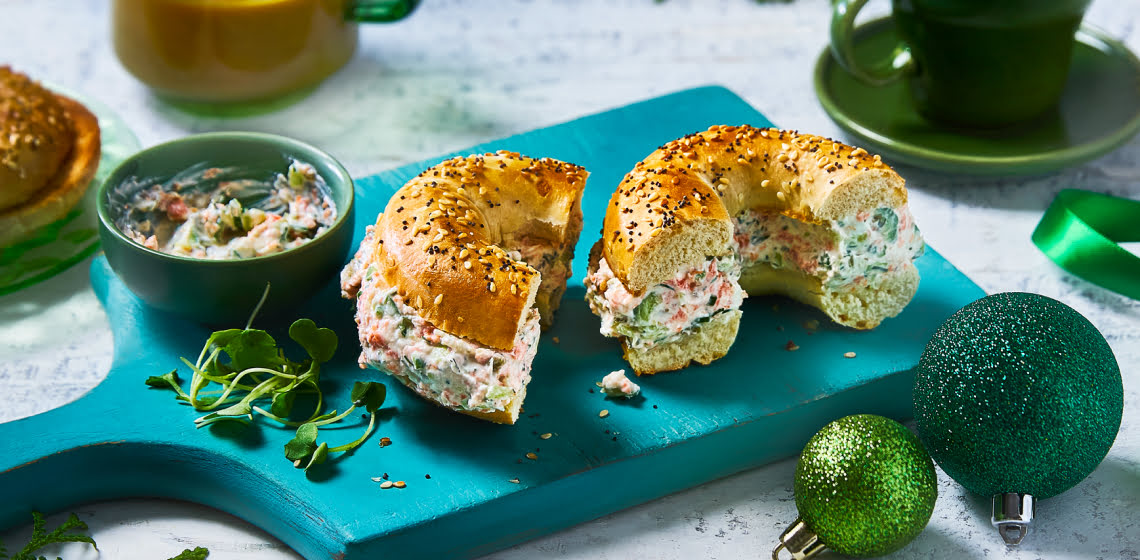 Chopped bagel on a turquoise cutting board