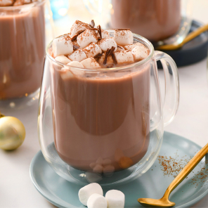 Classic hot chocolate with marshmallow in a glass mug