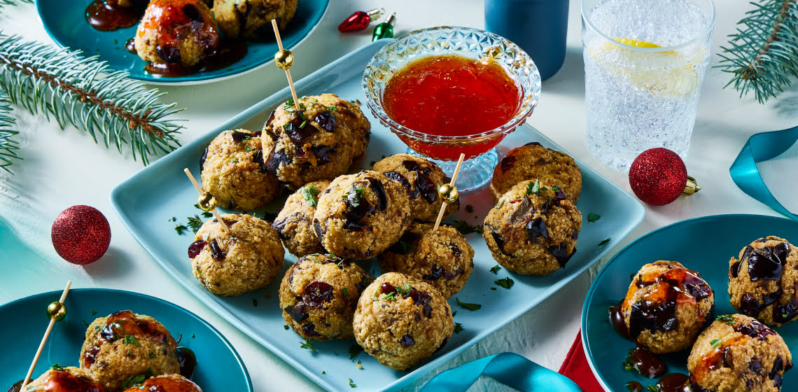 Plate of eggplant “meat”balls with a side of tangy red pepper topping