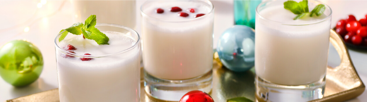 Three glasses of Frosty’s Margaritas on a gold serving tray