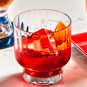 New fashioned in an old fashioned glass on a white countertop