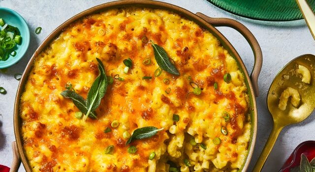 Overhead shot of baked three cheese mac and cheese topped with fried sage