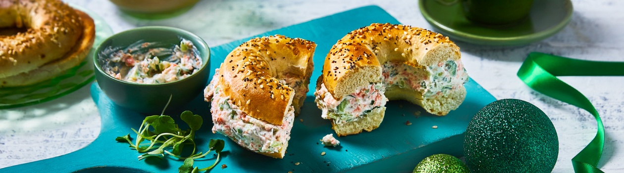 Chopped bagel on a turquoise cutting board