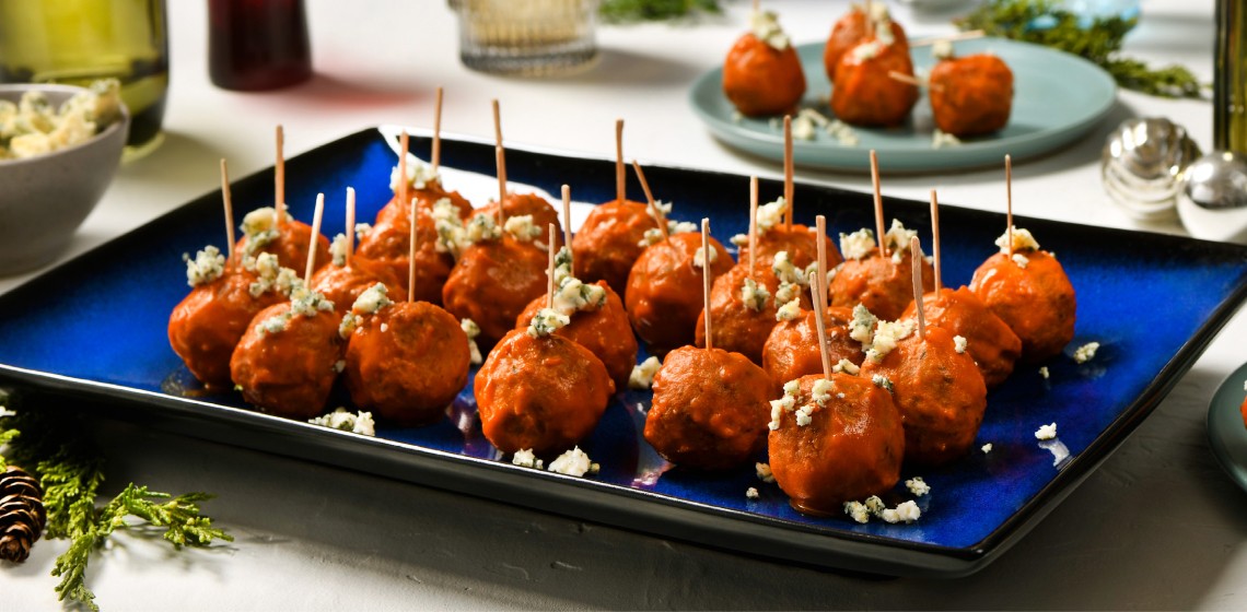 Buffalo chicken dip meatballs on a blue plate