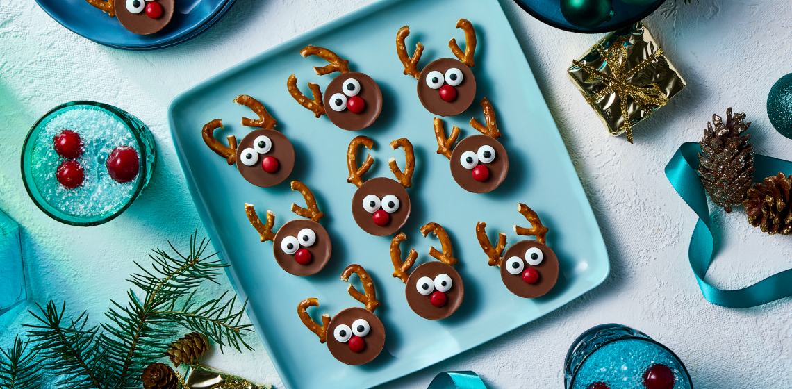 Overhead shot of reindeer peanut butter cups on a blue plate