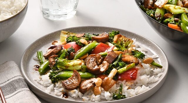 Plate of stir fry vegetables on marble surface