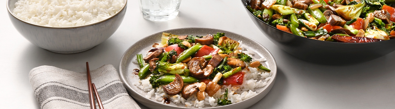 Plate of stir fry vegetables on marble surface