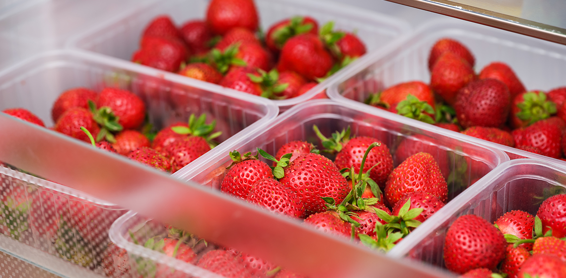 strawberryStorageTips Strawberries in plastic containers in fridge