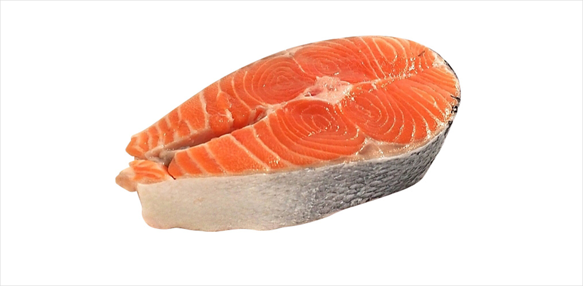 First-of-the-season sockeye salmon Raw sockeye salmon steak on white background